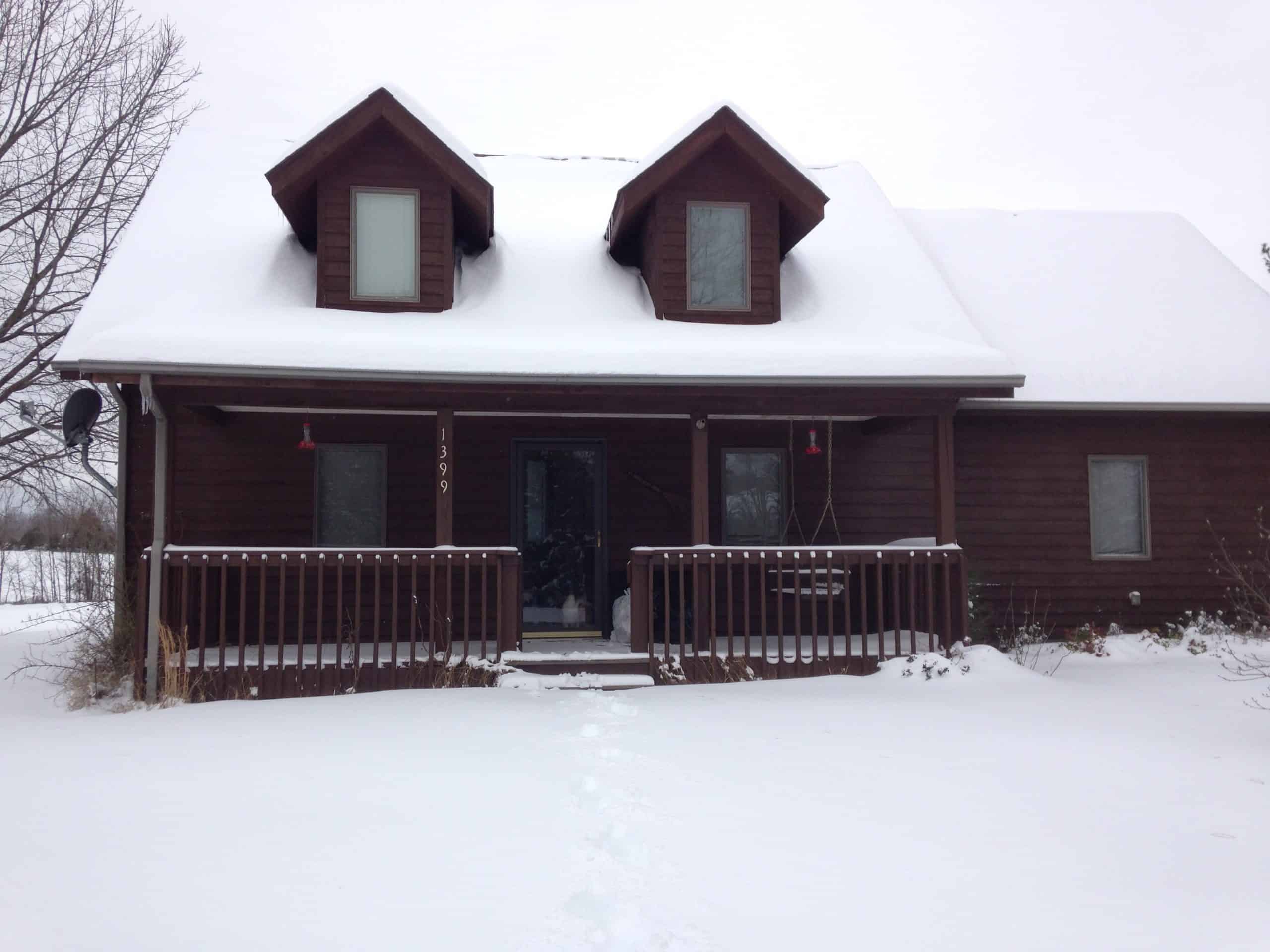 snowy farm house
