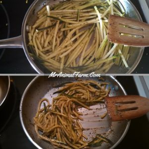zucchini noodles cooking in pan