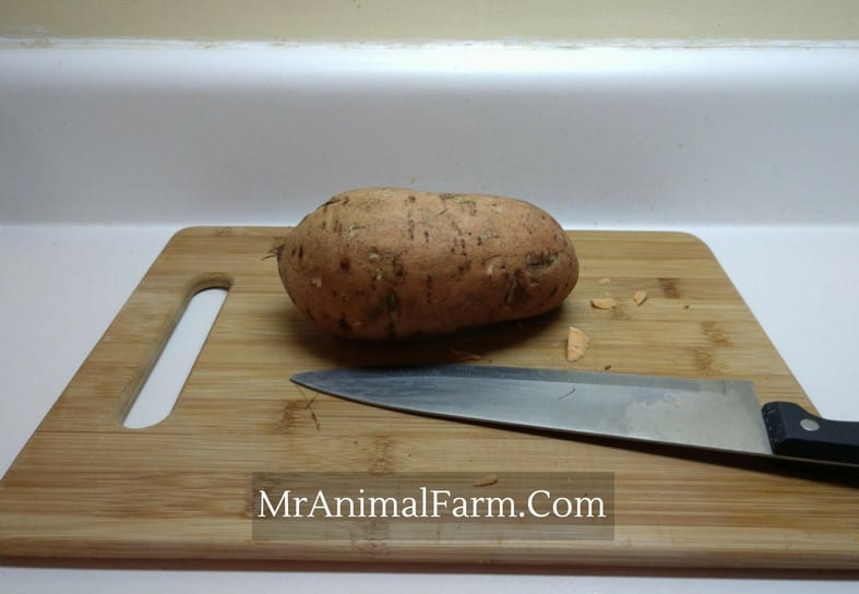  Sweet Potato on  cutting board with large knife