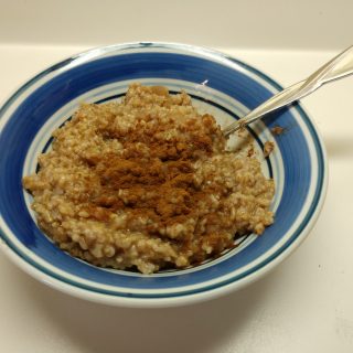 bowl of oatmeal with cinnamon on top