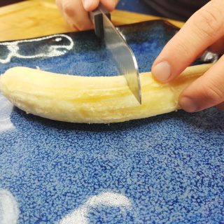 cutting a banana in half