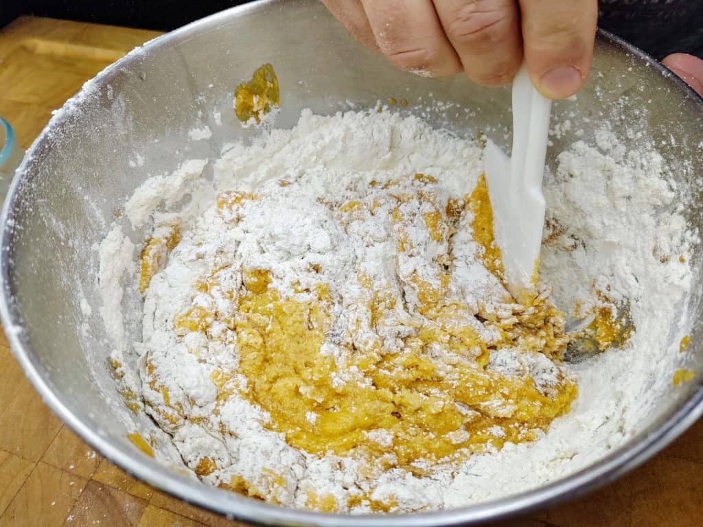 mixing flour into the pumpkin mix