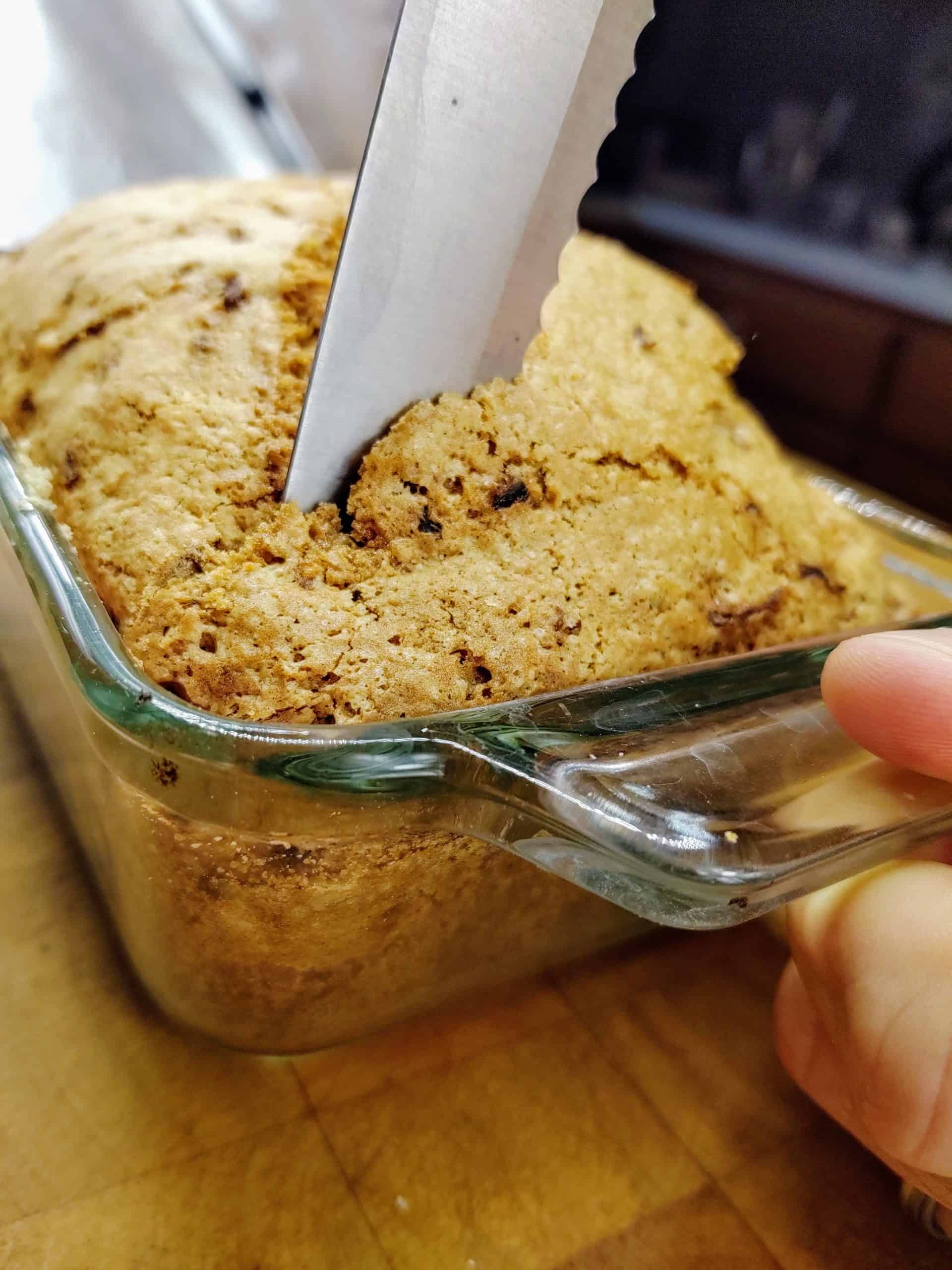 slicing zucchini bread in bread pan