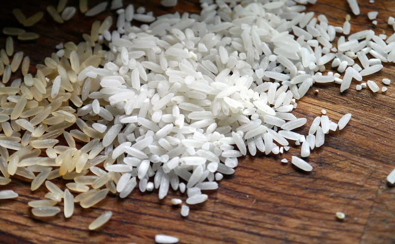 rice scattered on a wooden table