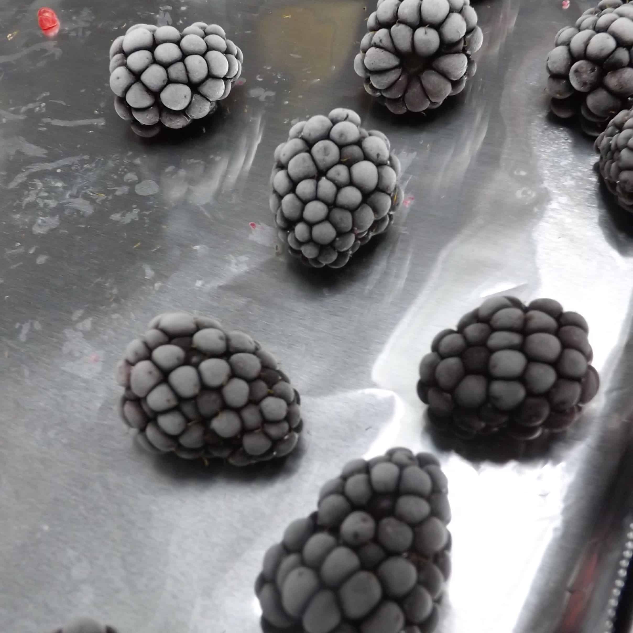 frozen blackberries on baking pan wrapped in foil