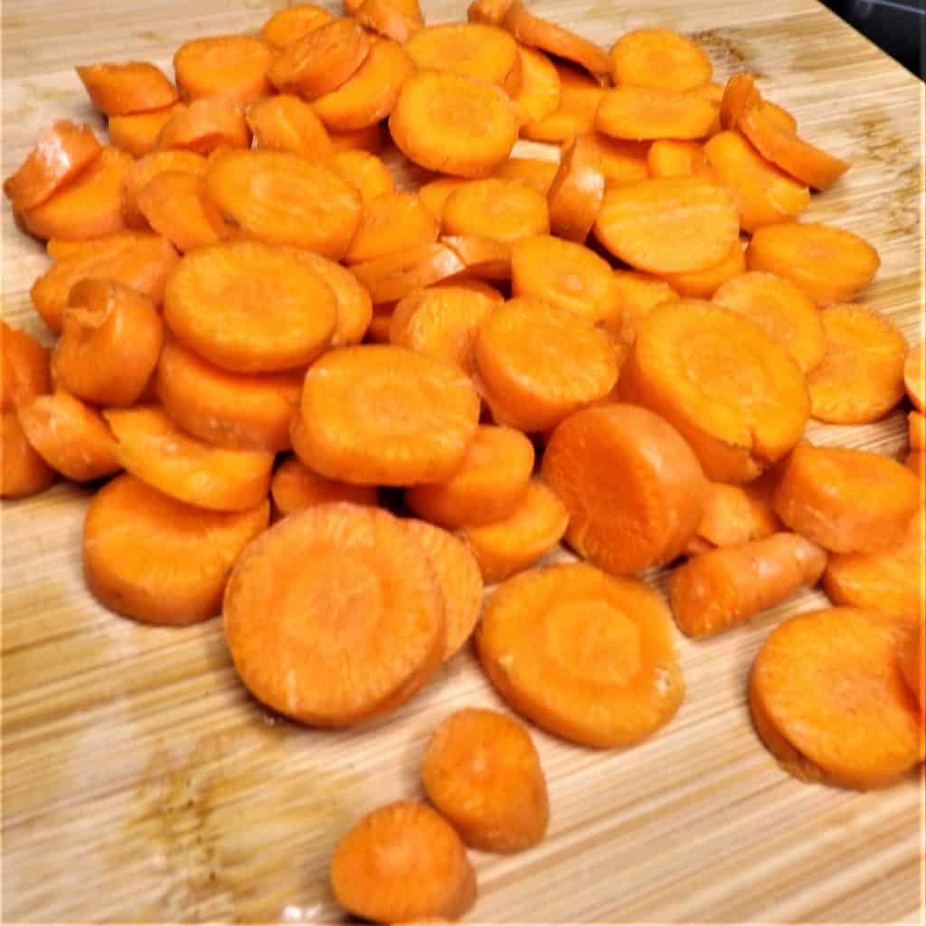 fresh cut carrots on cutting board