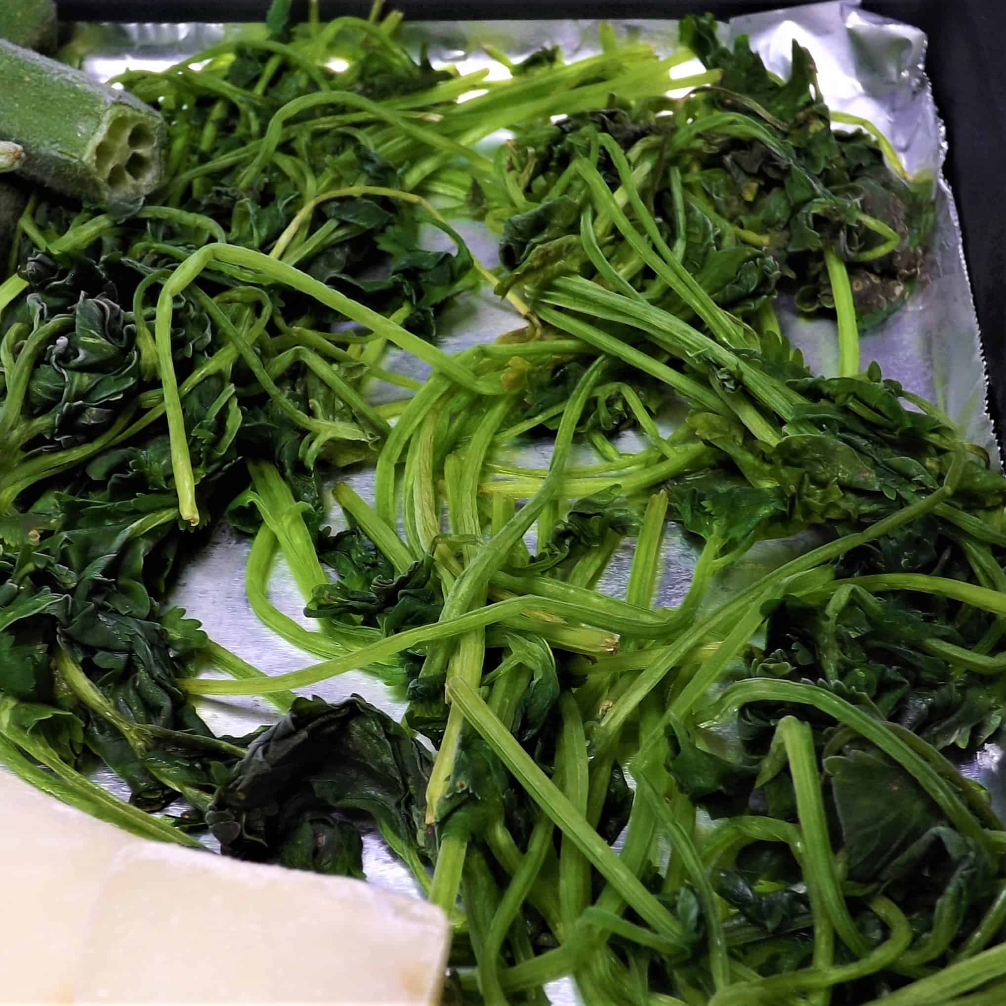 frozen cilantro on baking pan wrapped in foil