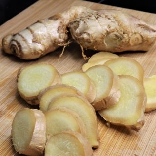 fresh cut ginger on cutting board