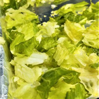 frozen lettuce on baking pan wrapped in foil