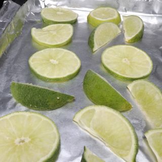 frozen limes on baking pan wrapped in foil