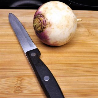 fresh turnip on cutting board