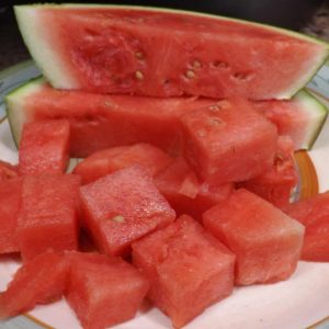 cut watermelon cubes and slices on a plate